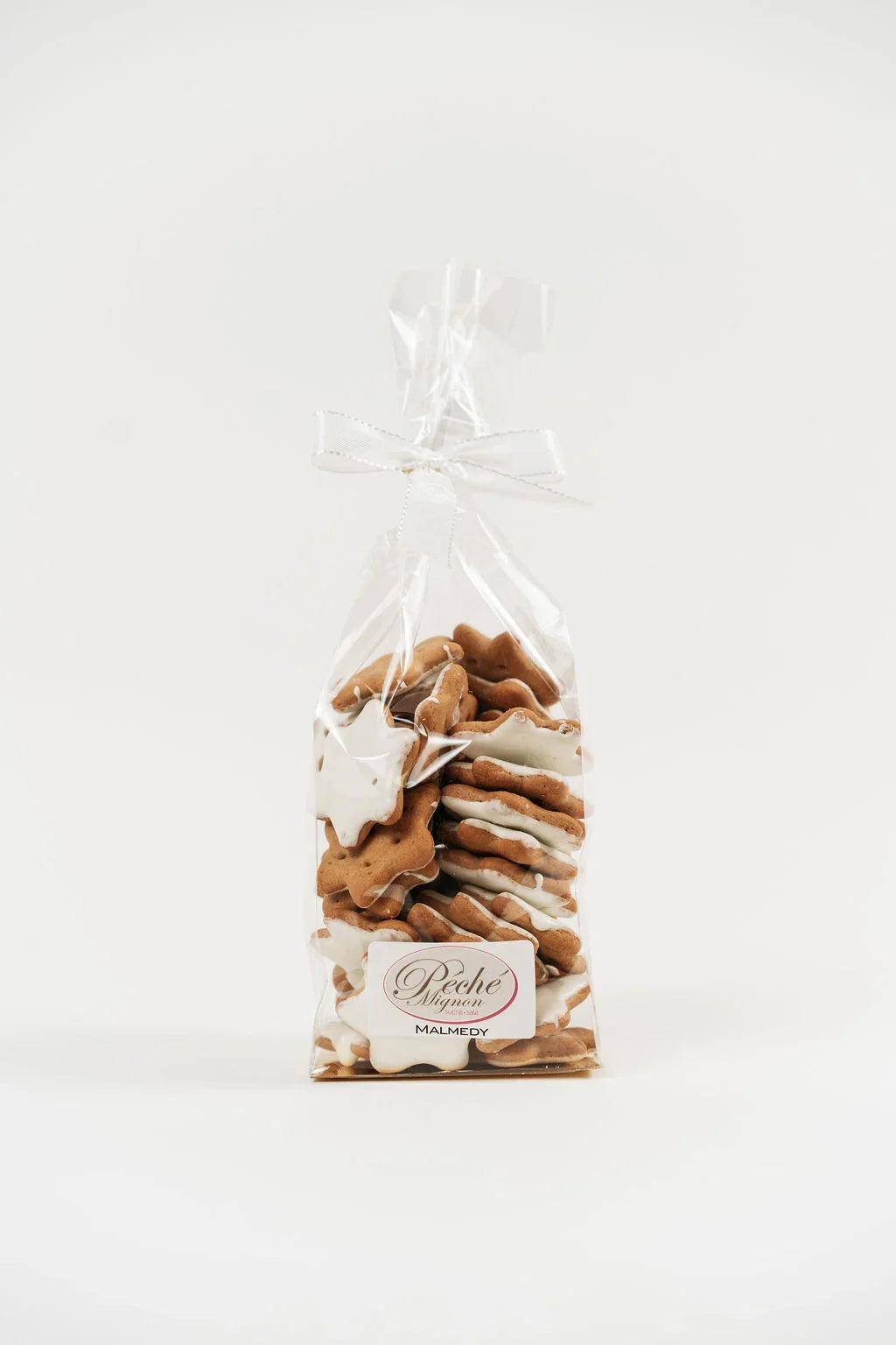 Biscuits glacés de Noël à la cannelle Péché Mignon, emballés pour offrir.