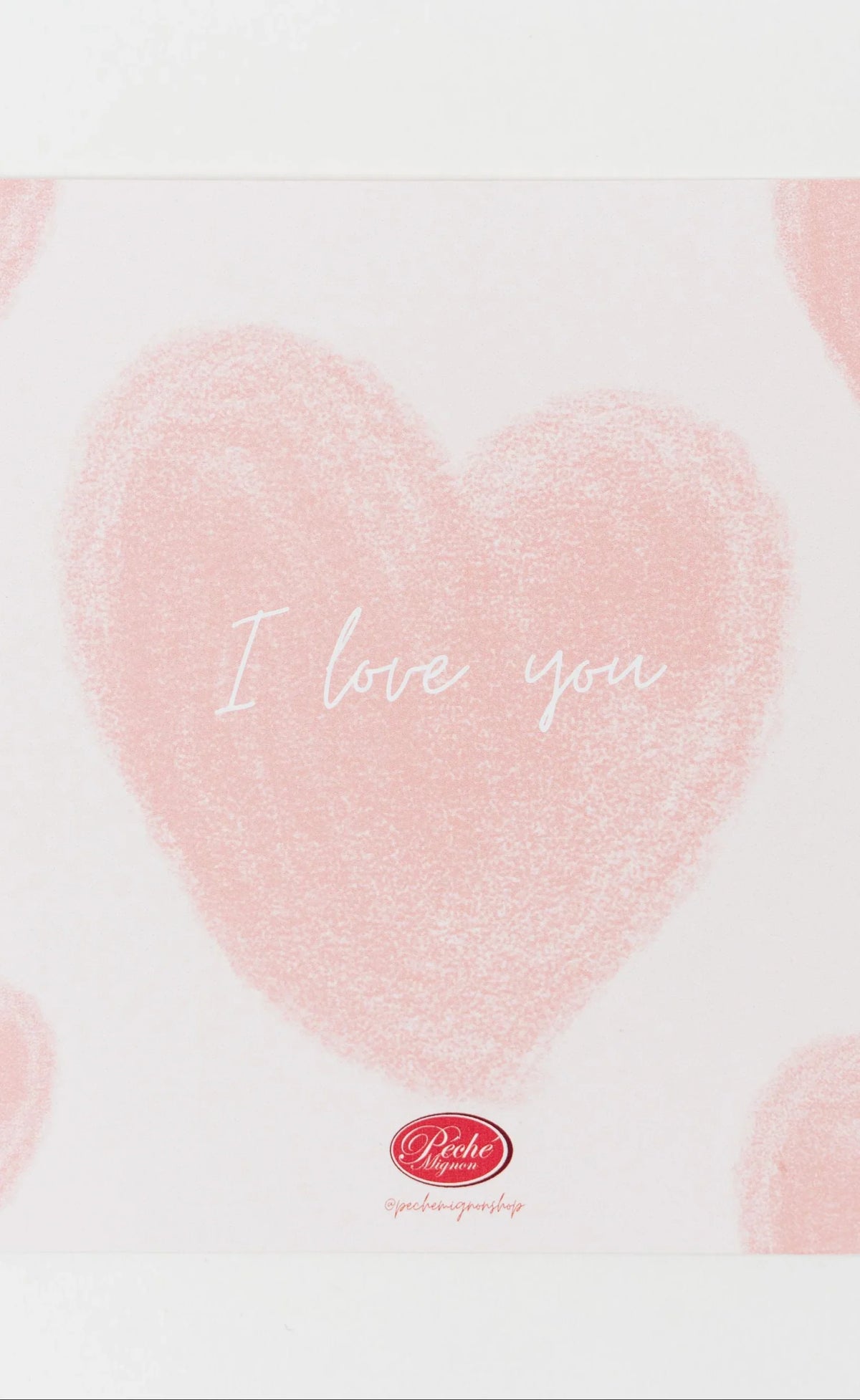 Biglietto d’auguri con testo “I love you” e cuori rosa su sfondo bianco