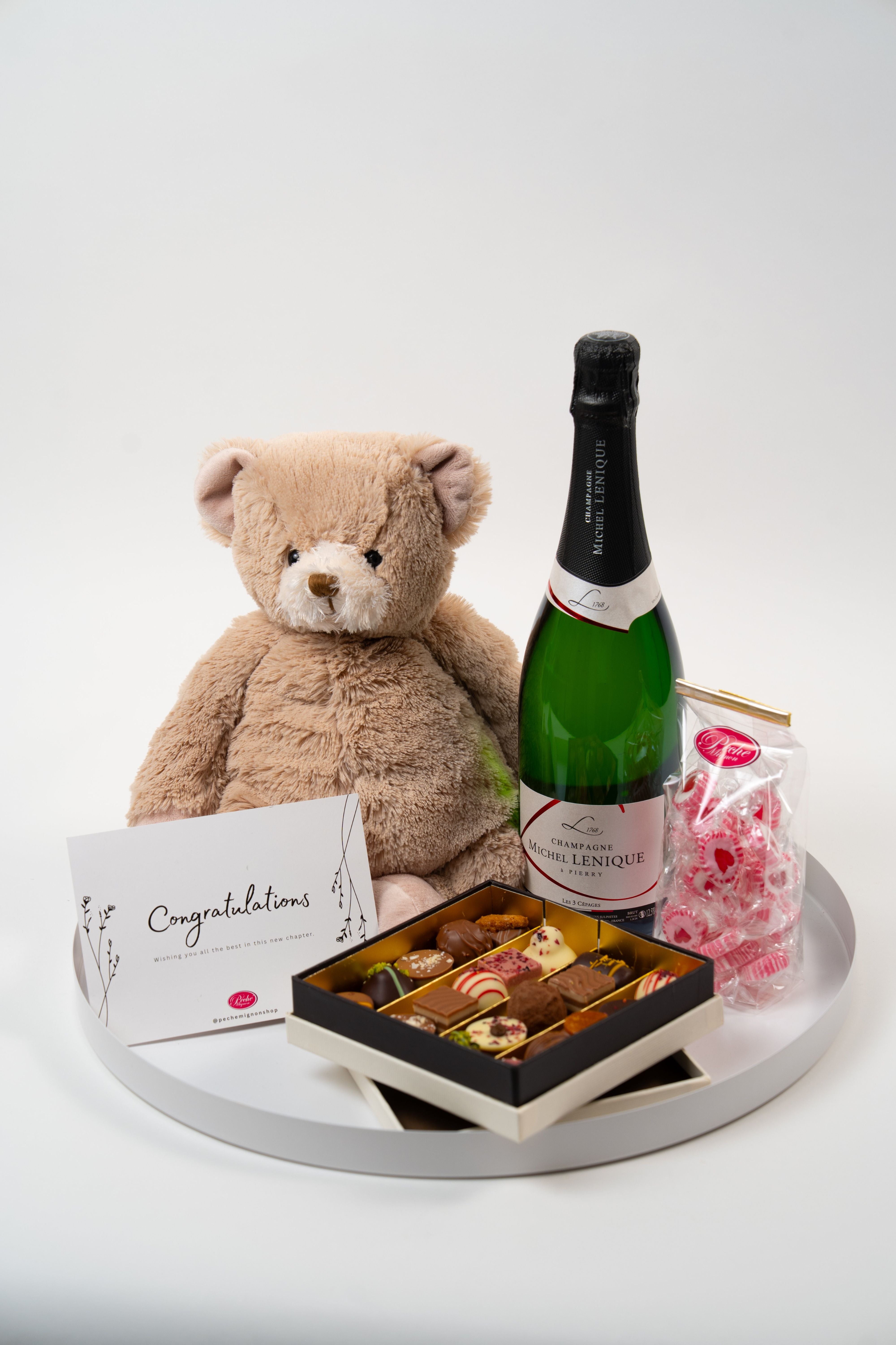 Baby celebration gift set with teddy bear, champagne and sweets from Péché Mignon