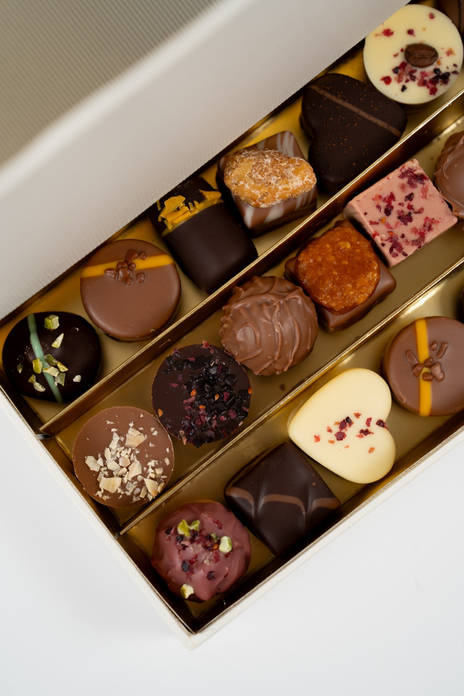 Close-up of the open gift box with Michel Lenique Champagne and artisan Nessi pralines