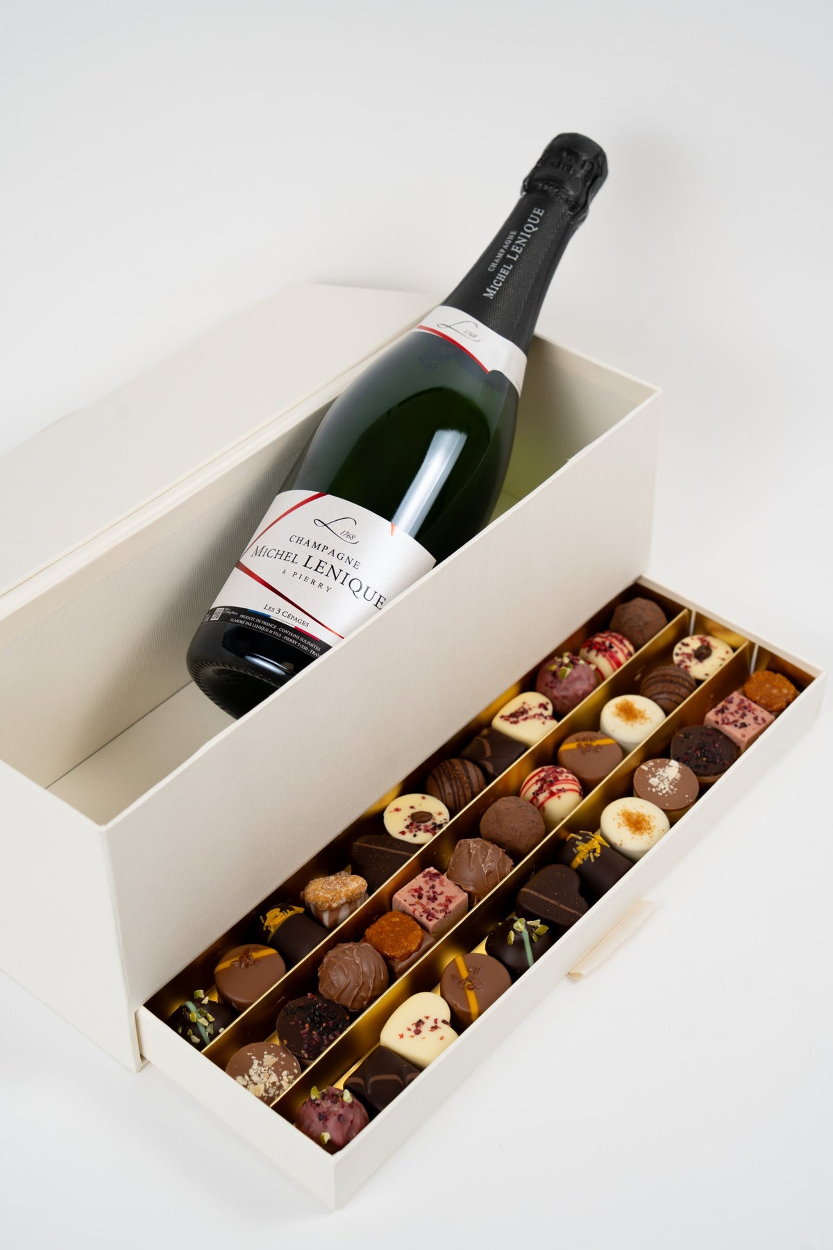 Open gift box with Michel Lenique Champagne and 350 g of artisan Nessi pralines