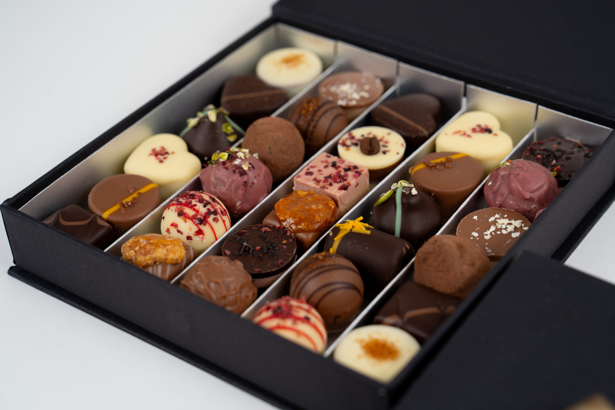 Péché-Mignon-Box mit einer Auswahl handwerklicher Pralinen