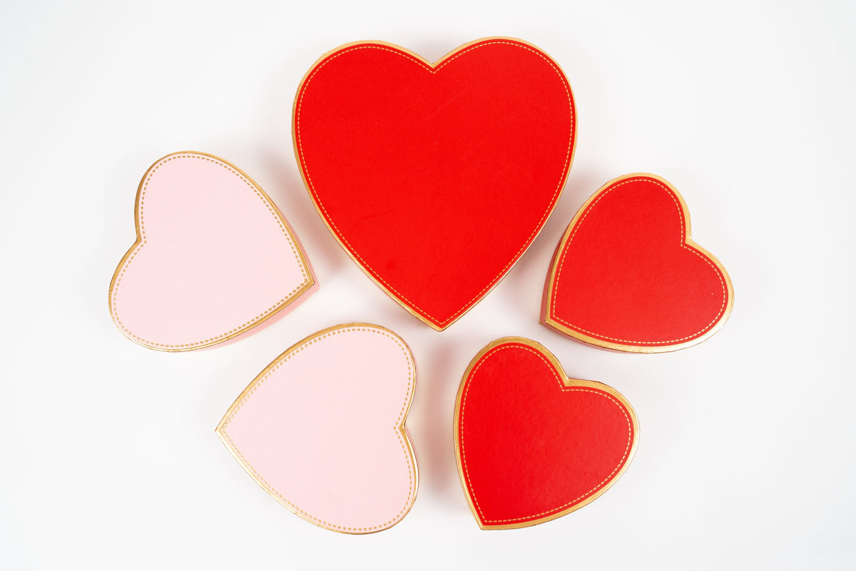 Closed red and pink heart-shaped boxes in different sizes