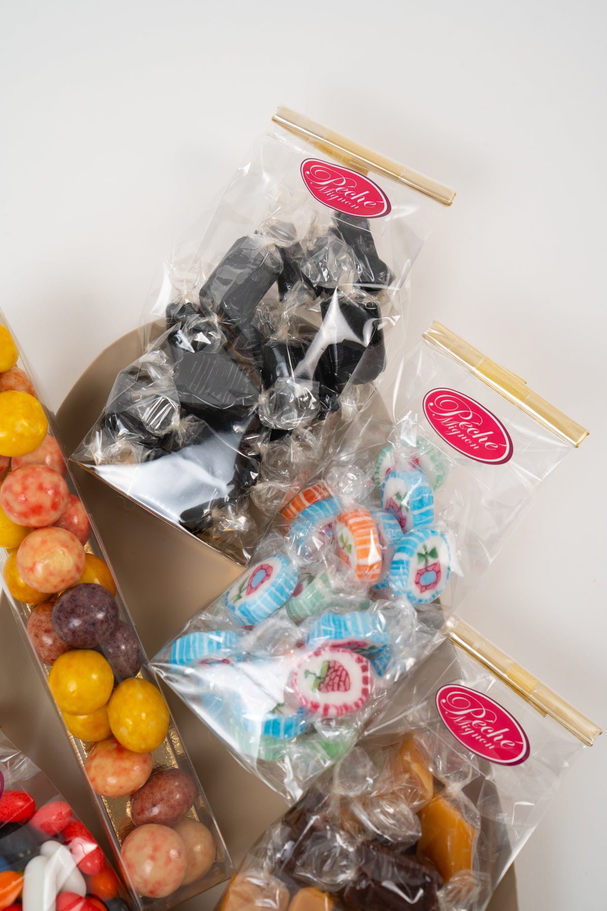 Assortment of Danish sweets including liquorice fruit candies and caramel in clear bags