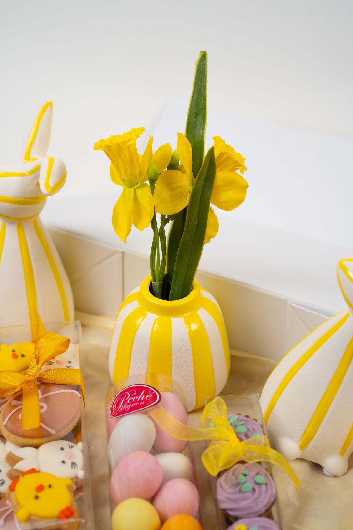 Spring flowers and Easter treats in a festive Péché Mignon Easter gift box.