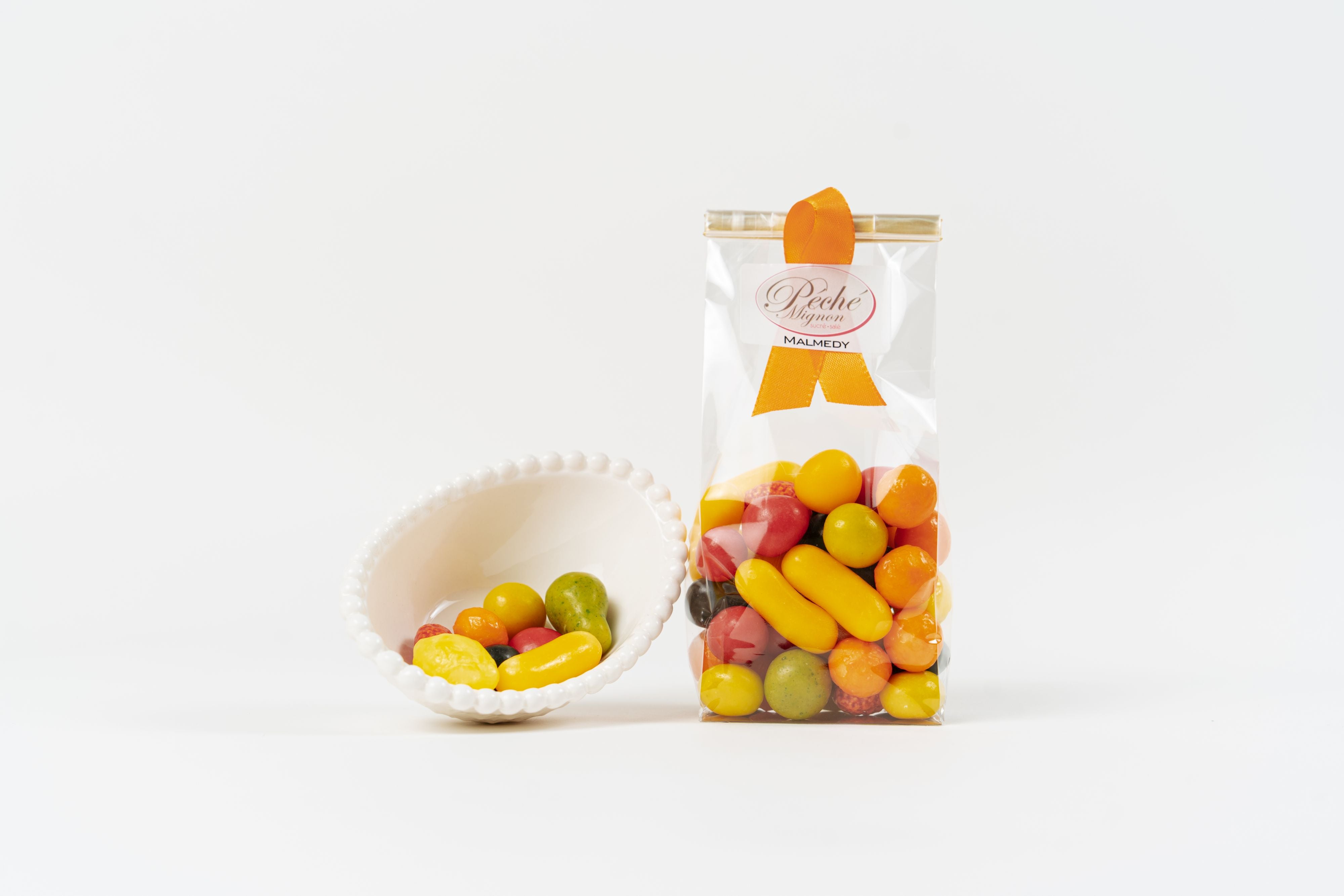 Sachet de Fruits Suisses avec bonbons fruités colorés Péché Mignon