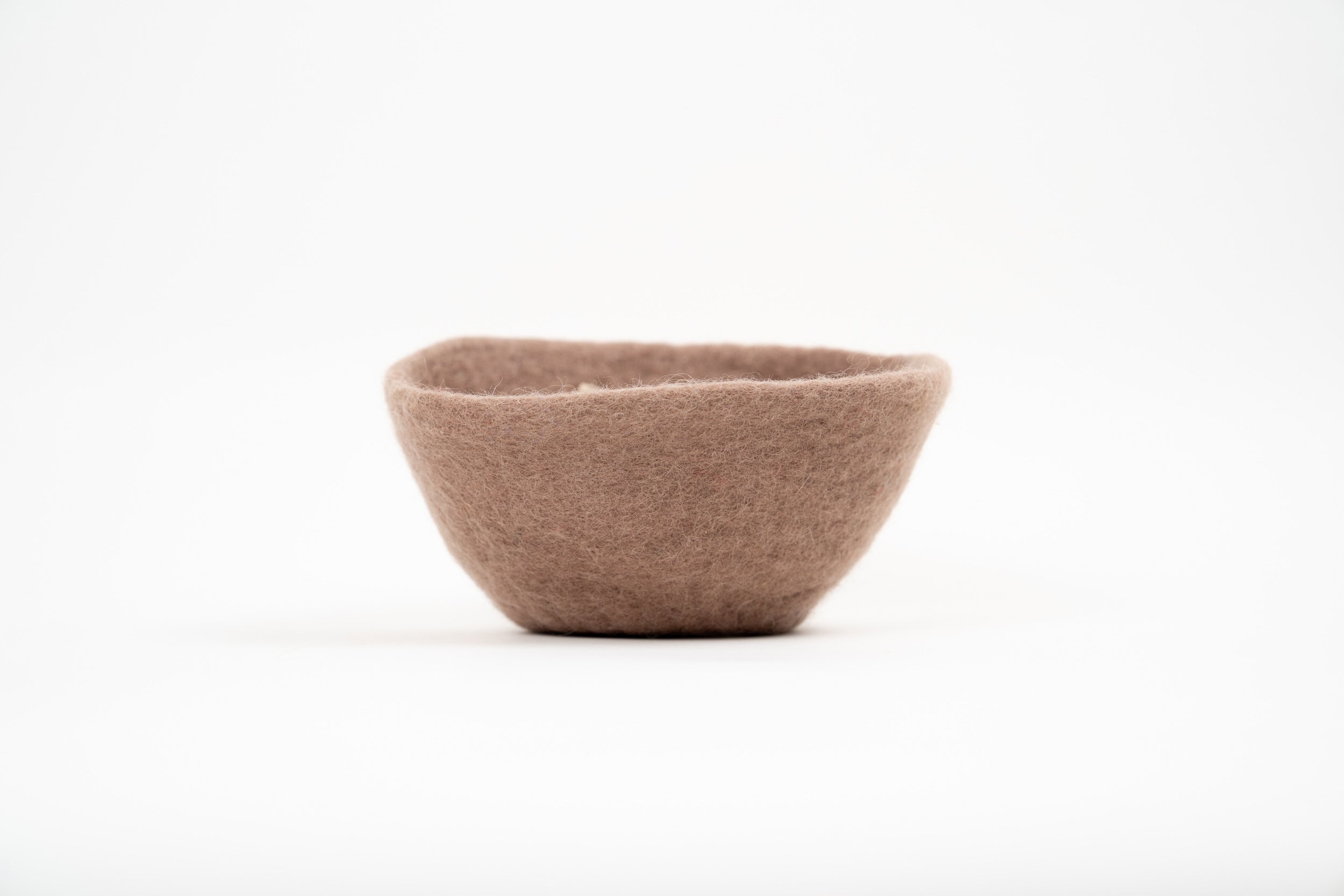 Gry & Sif rose felt basket photographed on a clean white background.