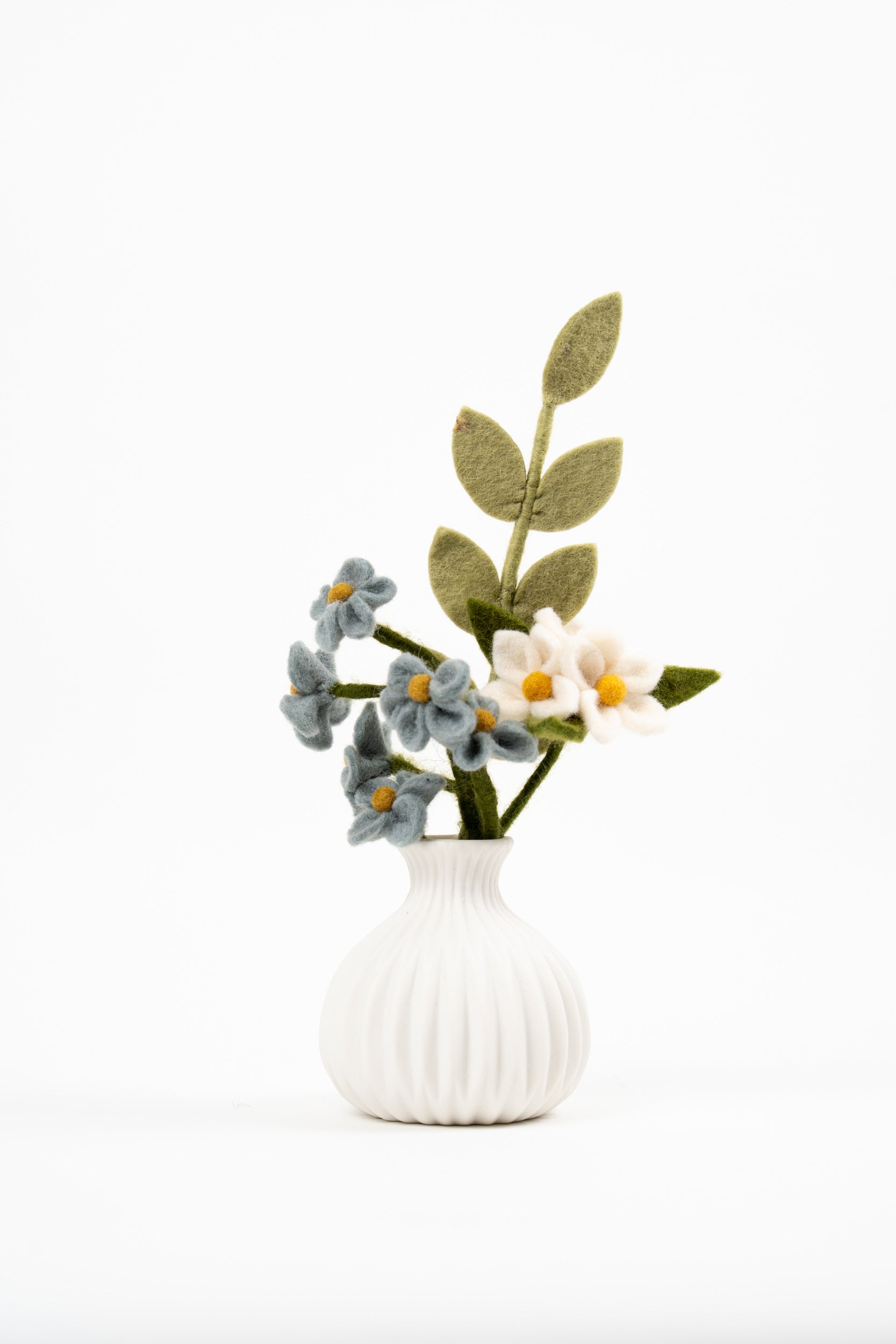 Handmade Gry & Sif felt mini bouquet with blue forget-me-not flowers, white anemones and green leaves in a white vase