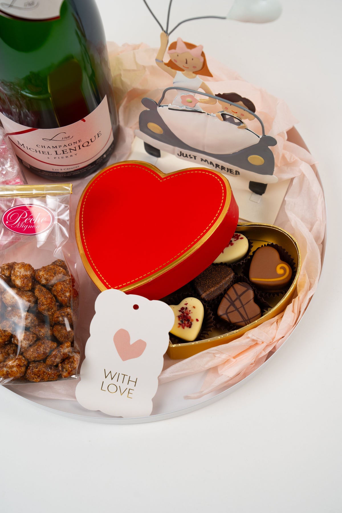 Heart shaped chocolate pralines in a romantic wedding gift box from Péché Mignon.