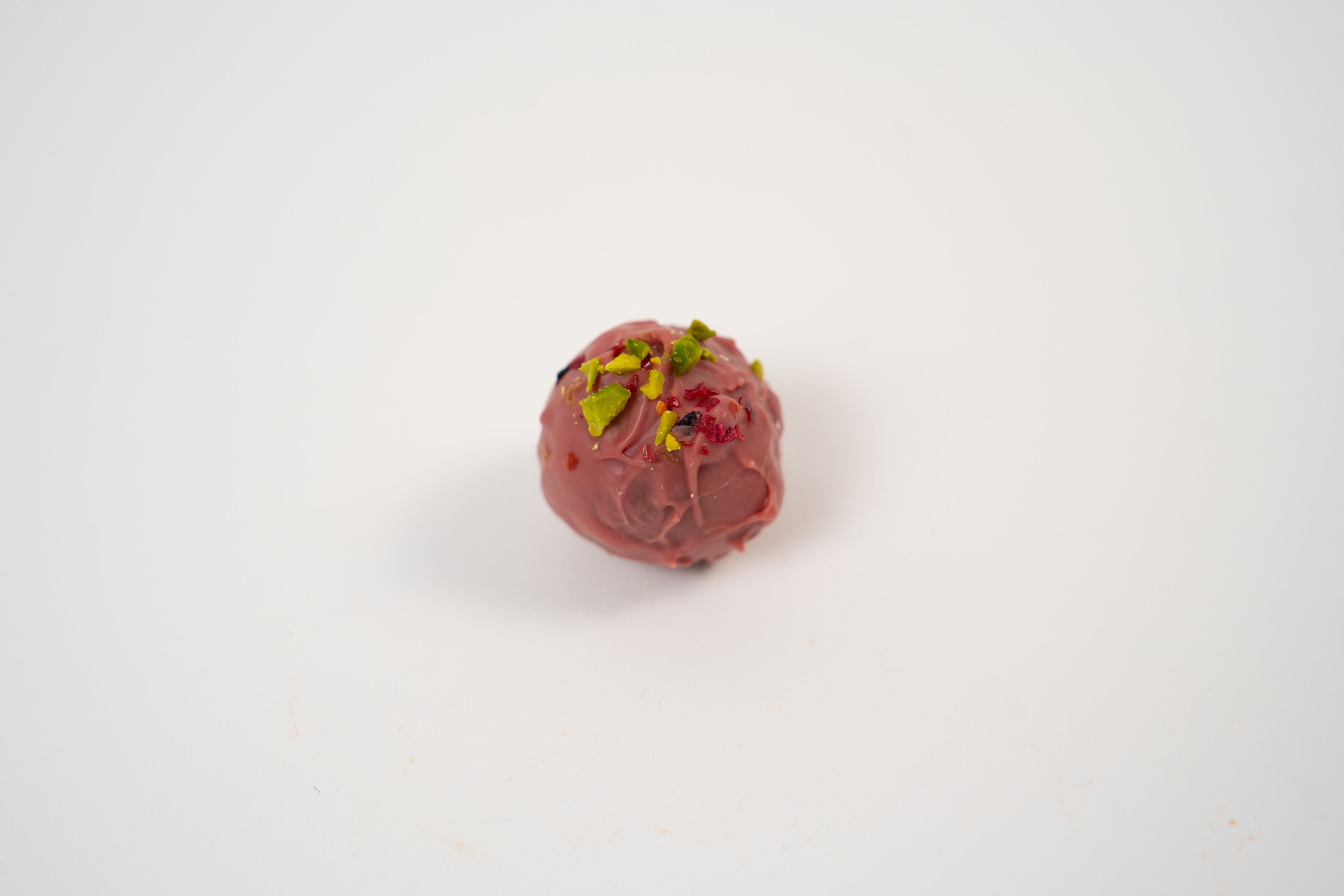 Passion fruit praline with ruby chocolate ganache