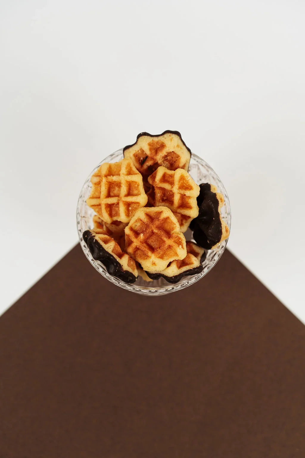 Mini butter and chocolate waffles presented in a bowl