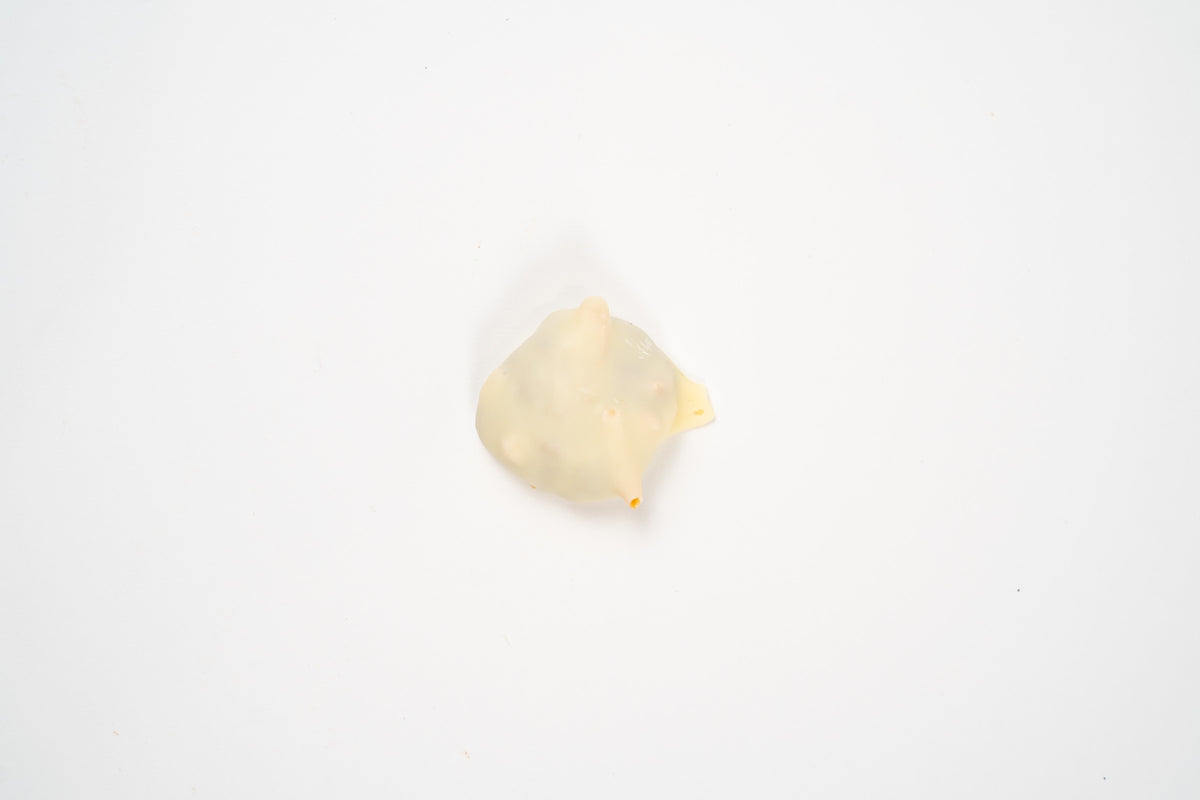 Mini Weichprinten aux noisettes enrobé de chocolat blanc, présenté individuellement sur fond blanc.