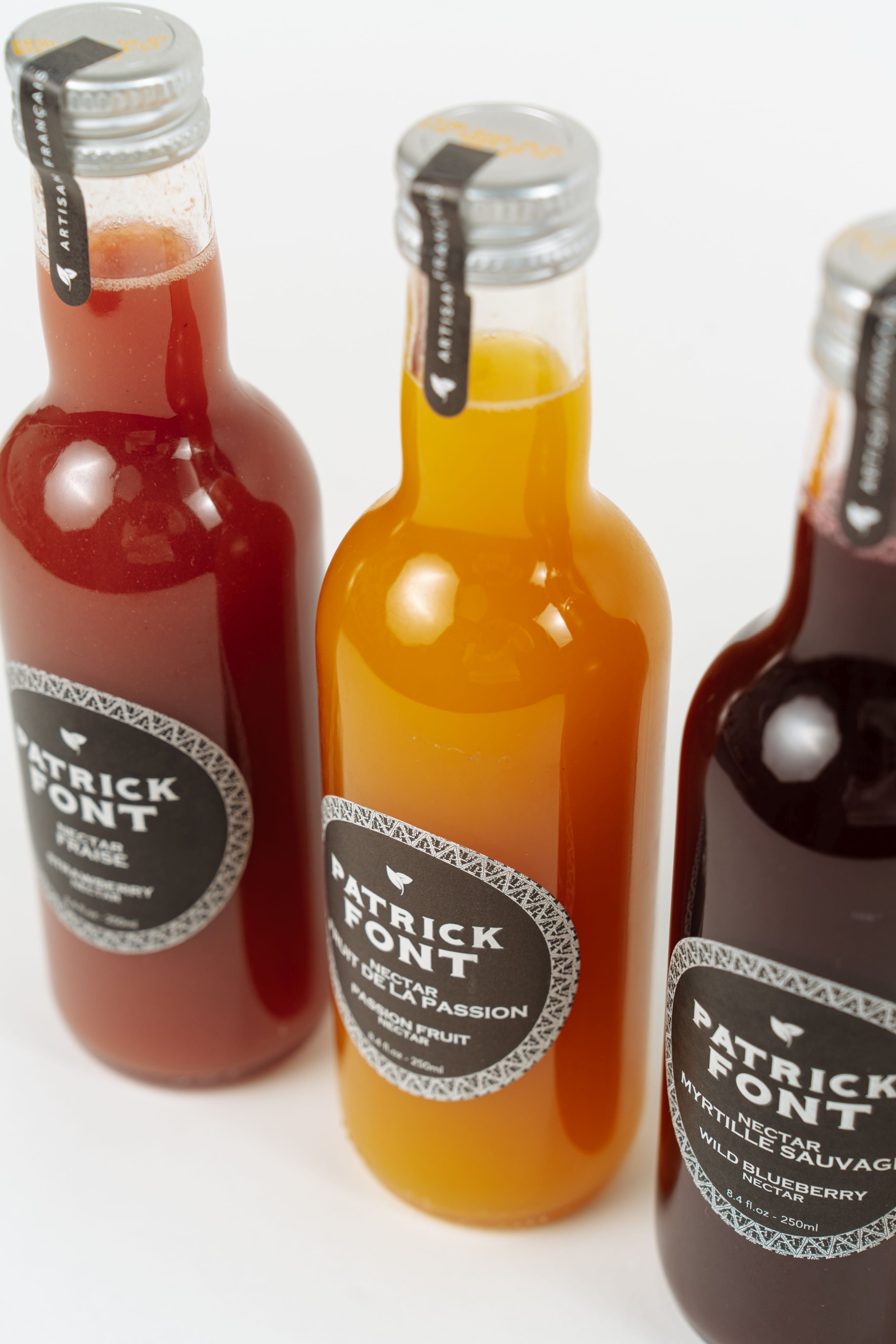 assortment of Patrick Font fruit nectars including passion fruit, strawberry and orange
