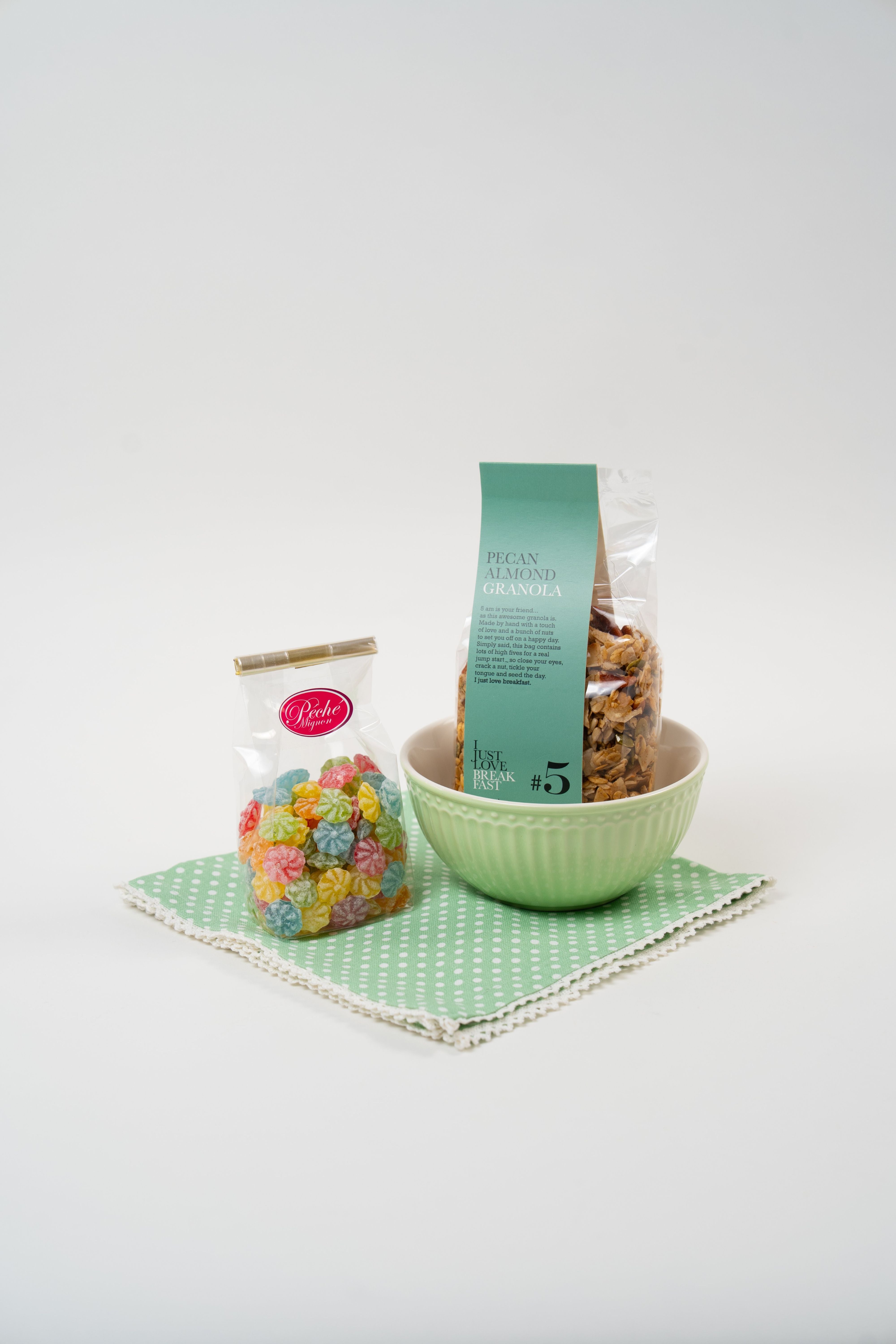 Le Péché Mignon Breakfast Bliss gift box with pecan almond granola, colorful candy, Greengate bowl and green polka dot napkin