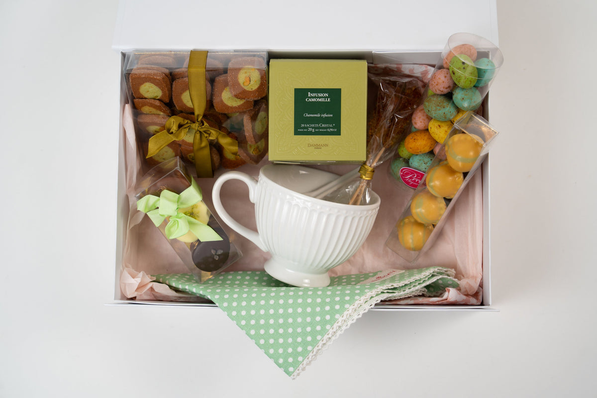 Spring tea gift box with chocolates, biscuits, chamomile infusion and teacup from Péché Mignon