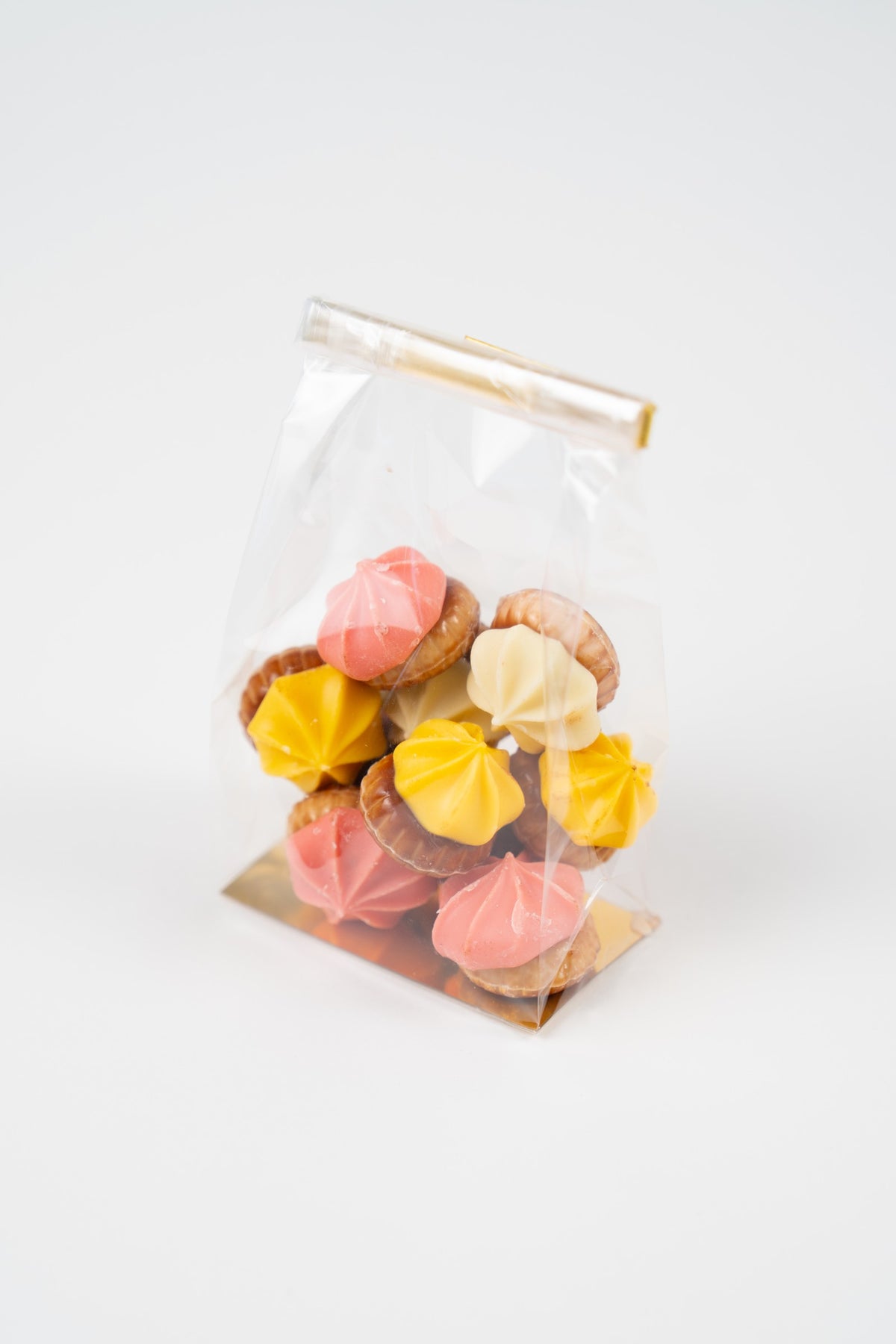 Sachet Péché Mignon de pic-nics assortis aux saveurs framboise, banane et chocolat blanc, présenté sur fond clair.