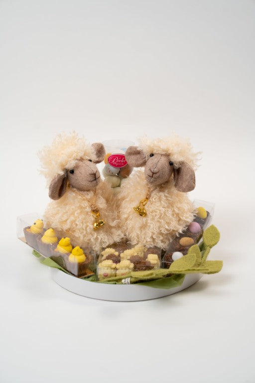 Easter chocolate gift platter with two plush lamb decorations and assorted artisanal chocolates from Le Péché Mignon.