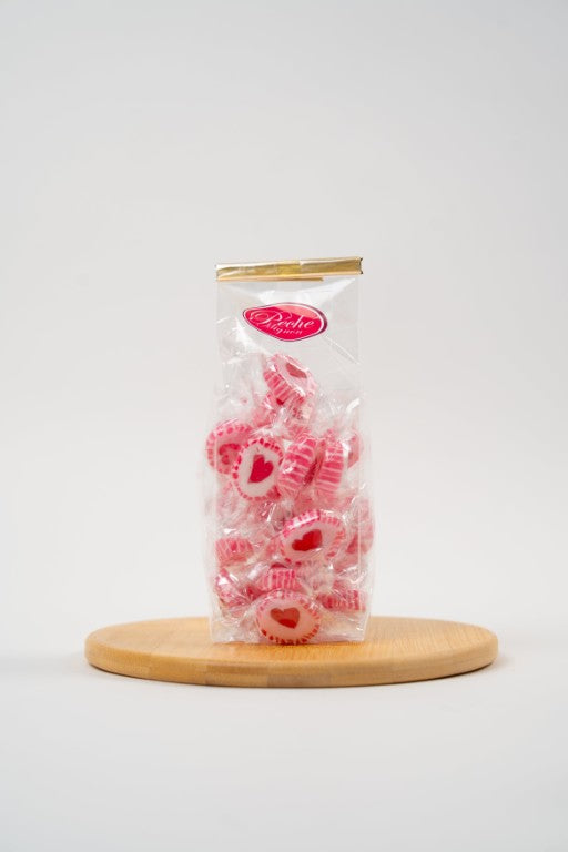 sachet plastique rempli de mini bonbons coeurs acidules