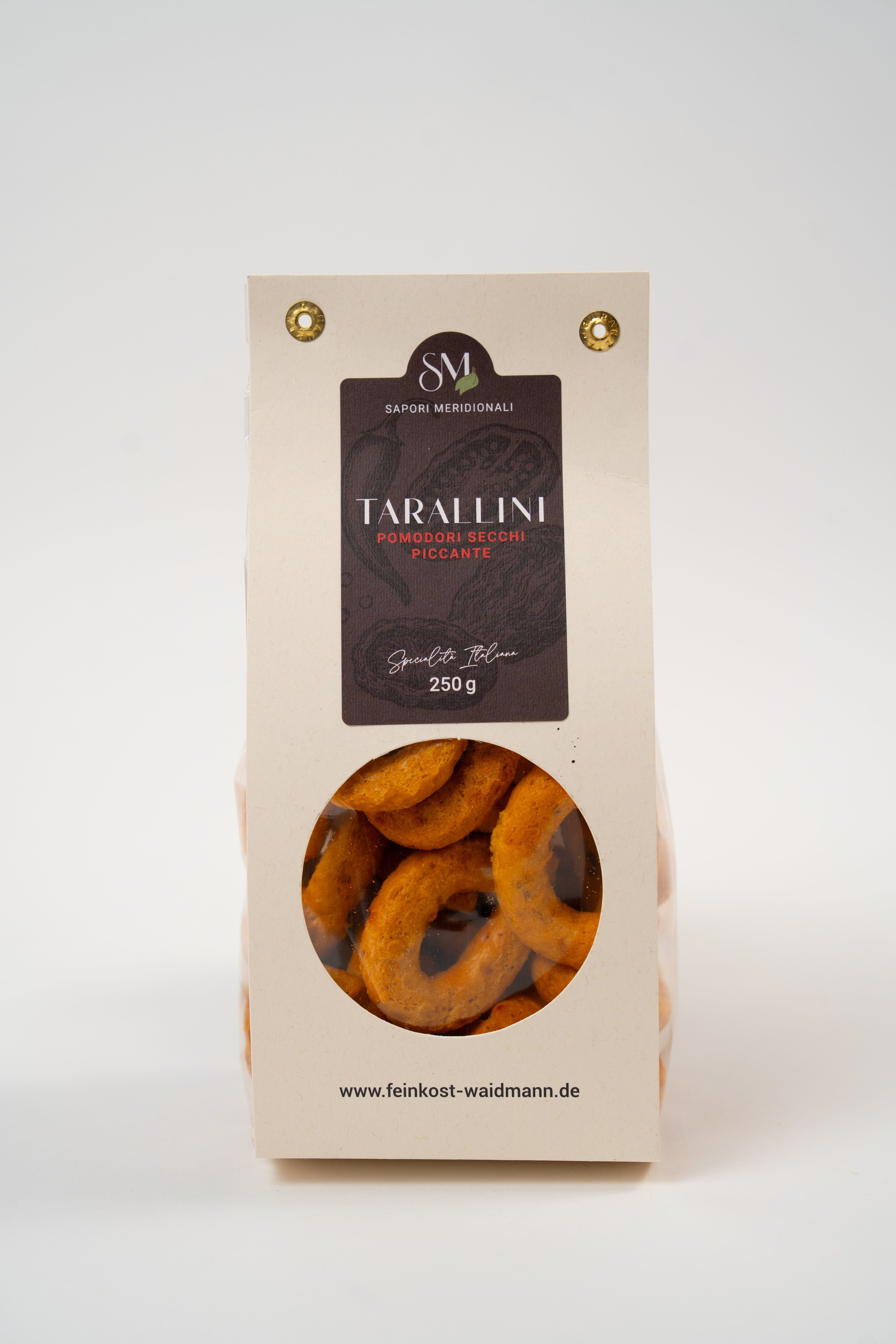 Tarallini with dried tomatoes and chili pepper, traditional Italian savory snack, 250g pack