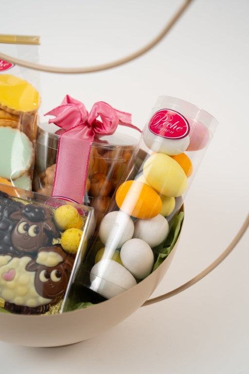 Close-up of Easter chocolate assortment with sugar-coated eggs and pralines from Le Péché Mignon.