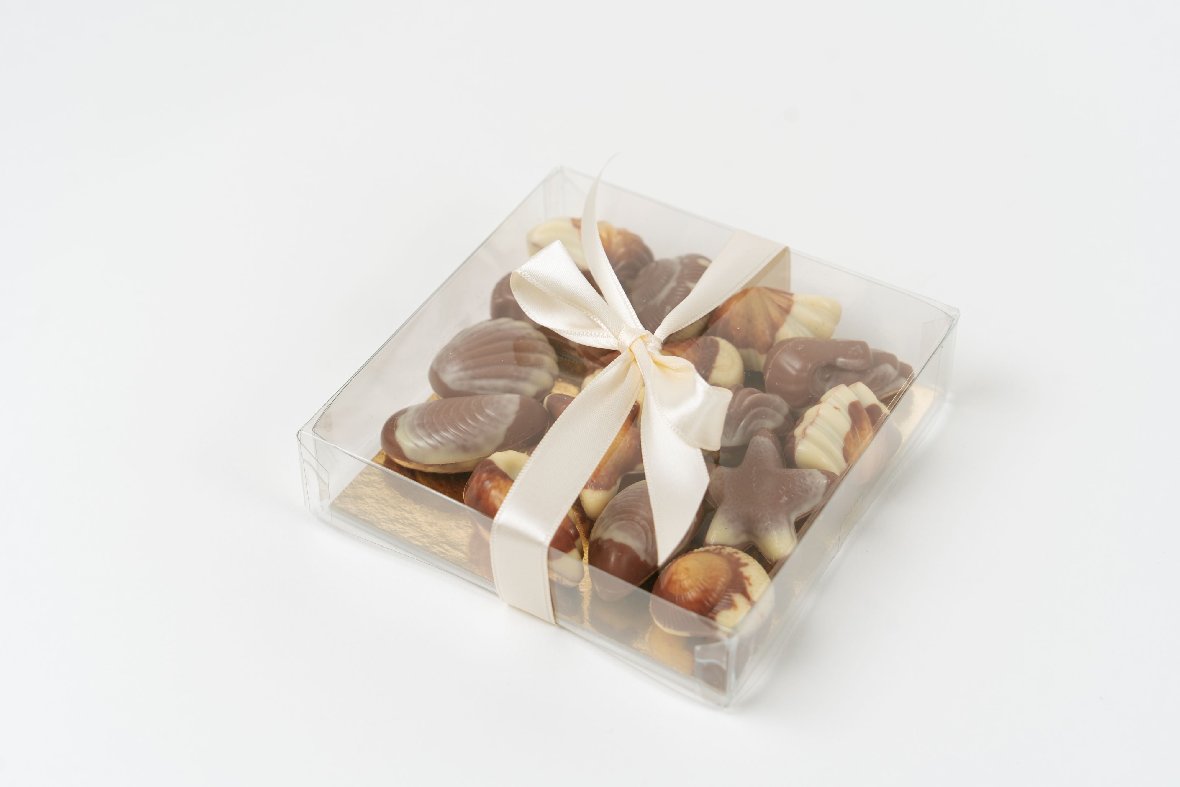 Gift box of Belgian marbled seashell chocolates with ribbon