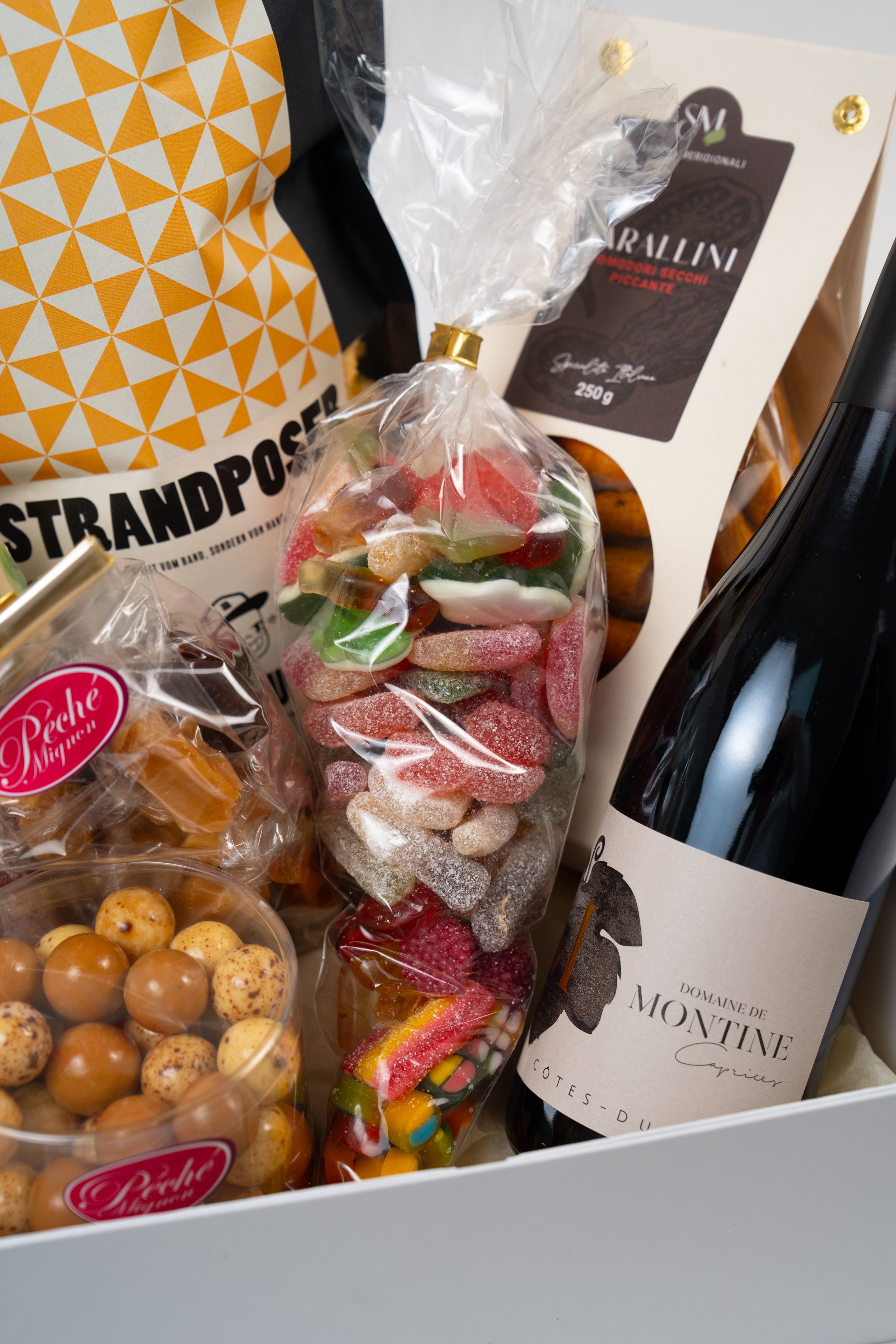 Close-up of home cinema gift box with assorted sweets, chocolate treats and snacks from Le Péché Mignon.