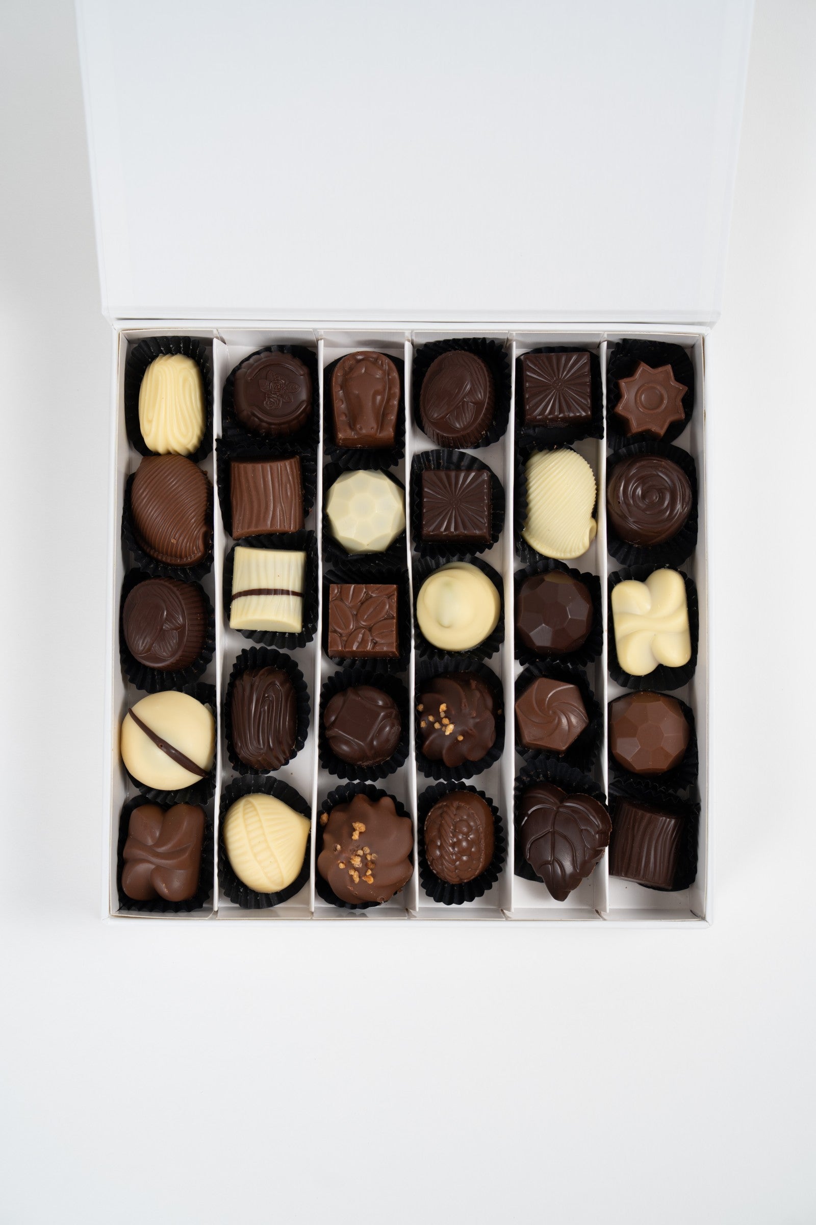 Coffret Péché Mignon garni d’un assortiment de pralines artisanales belges