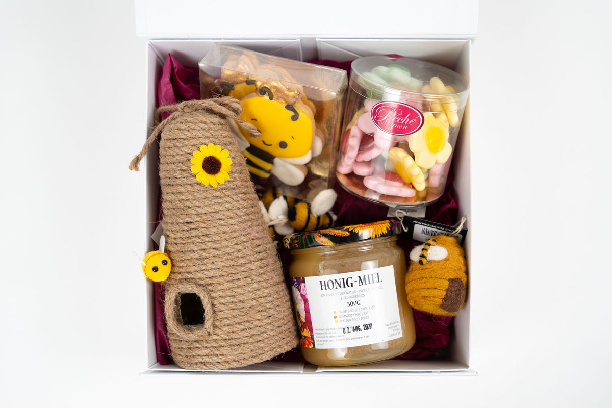 Gourmet honey gift box with artisan sweets and bee themed treats