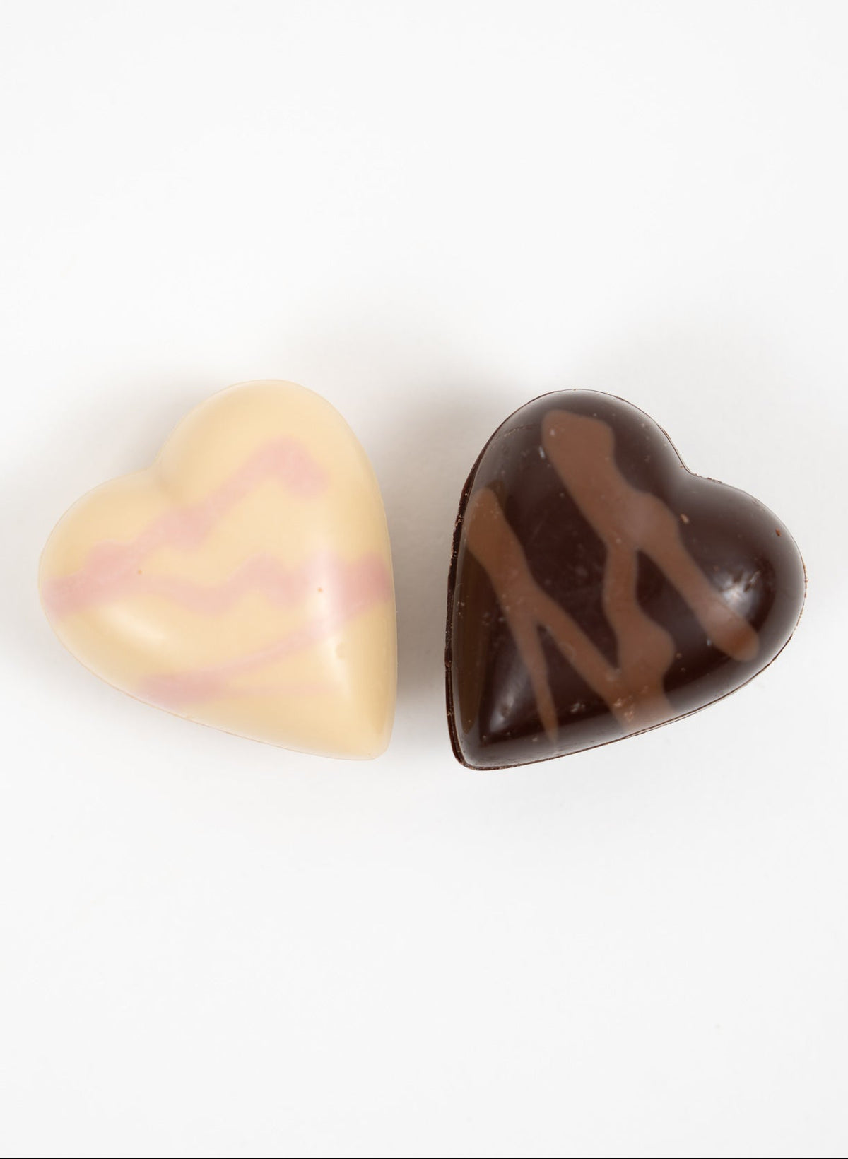 Assorted heart-shaped chocolates in milk and white chocolate