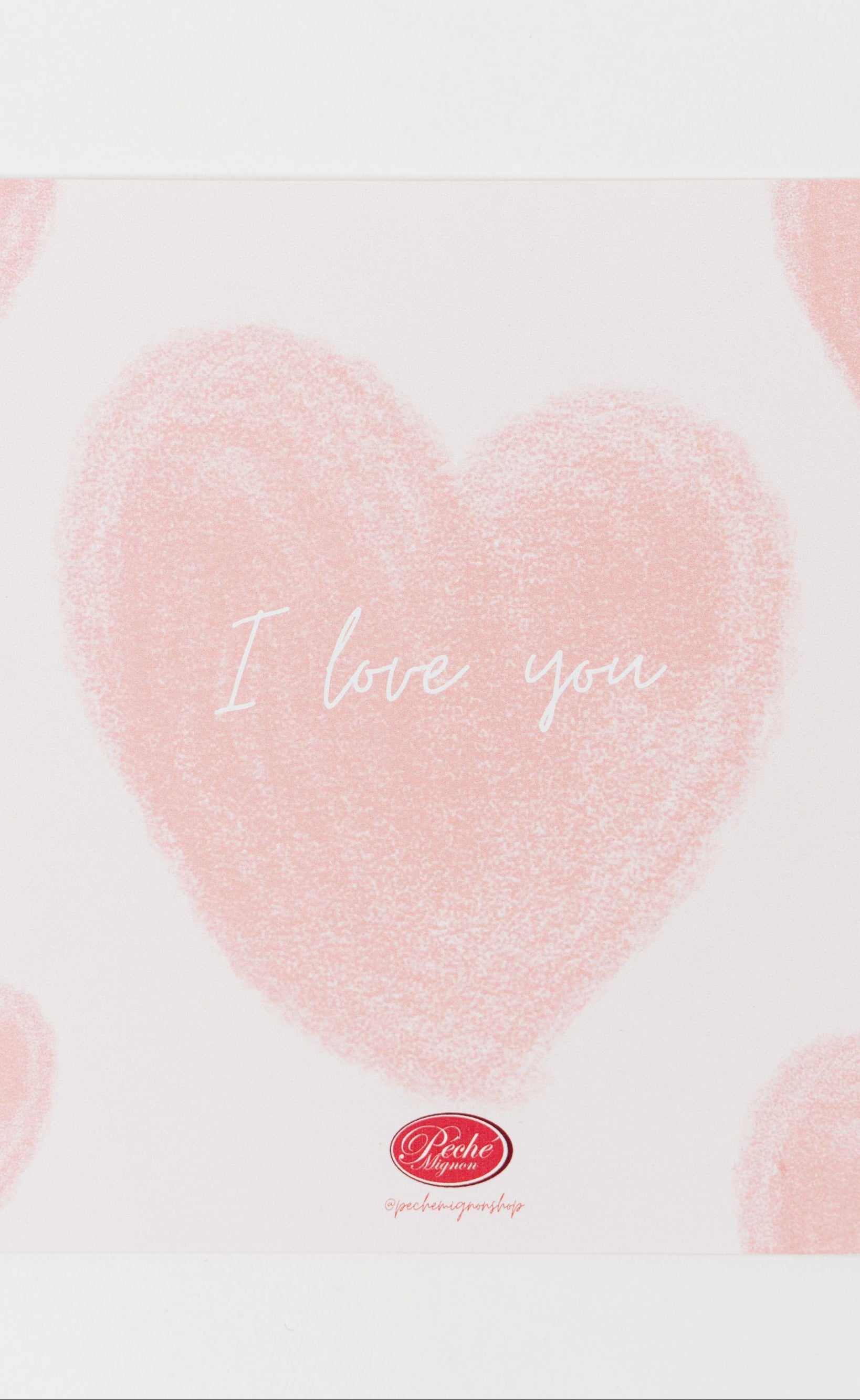 “I love you” greeting card with soft pink heart design on white background