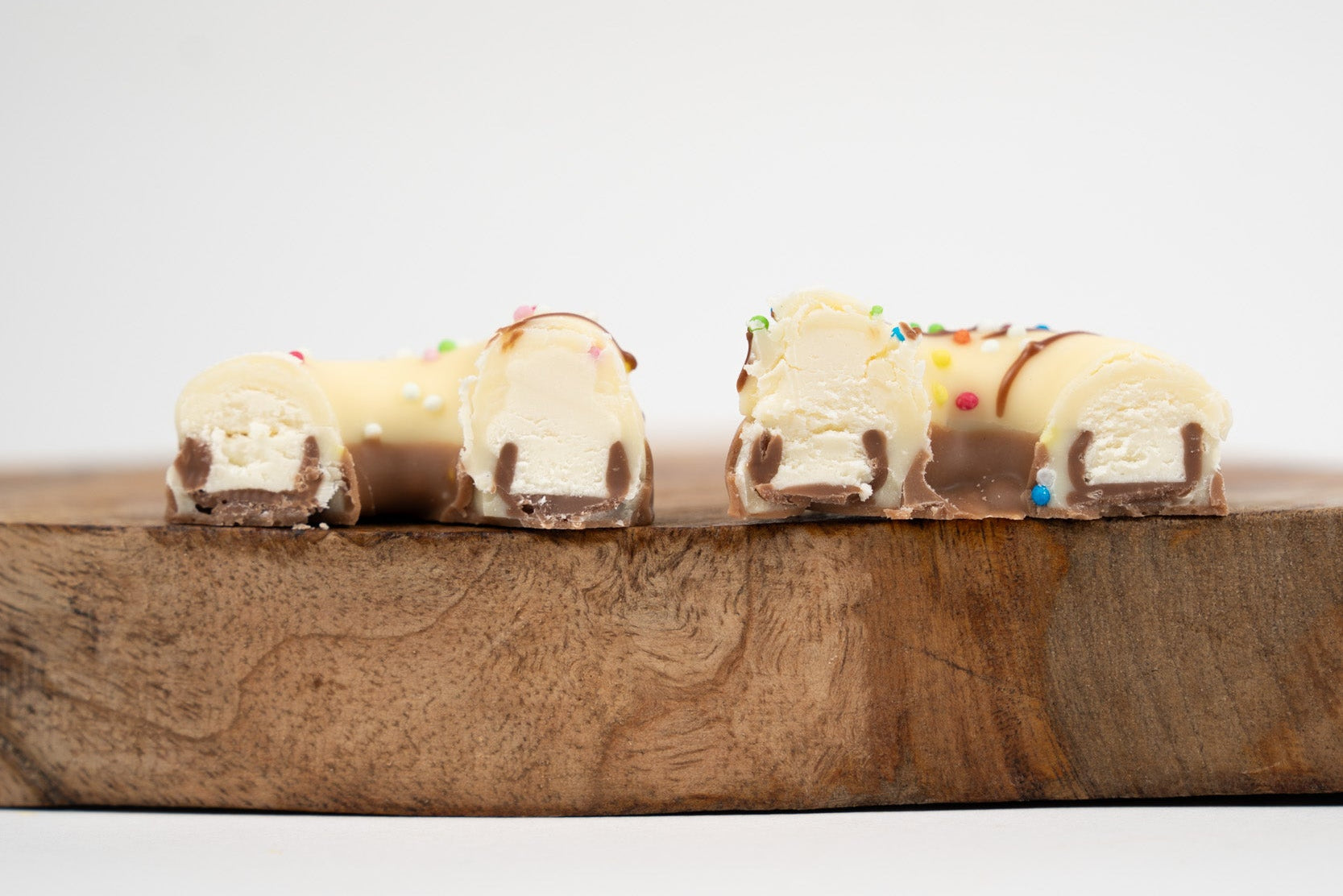 Milkshake filled chocolate in donut shape with creamy centre and chocolate coating