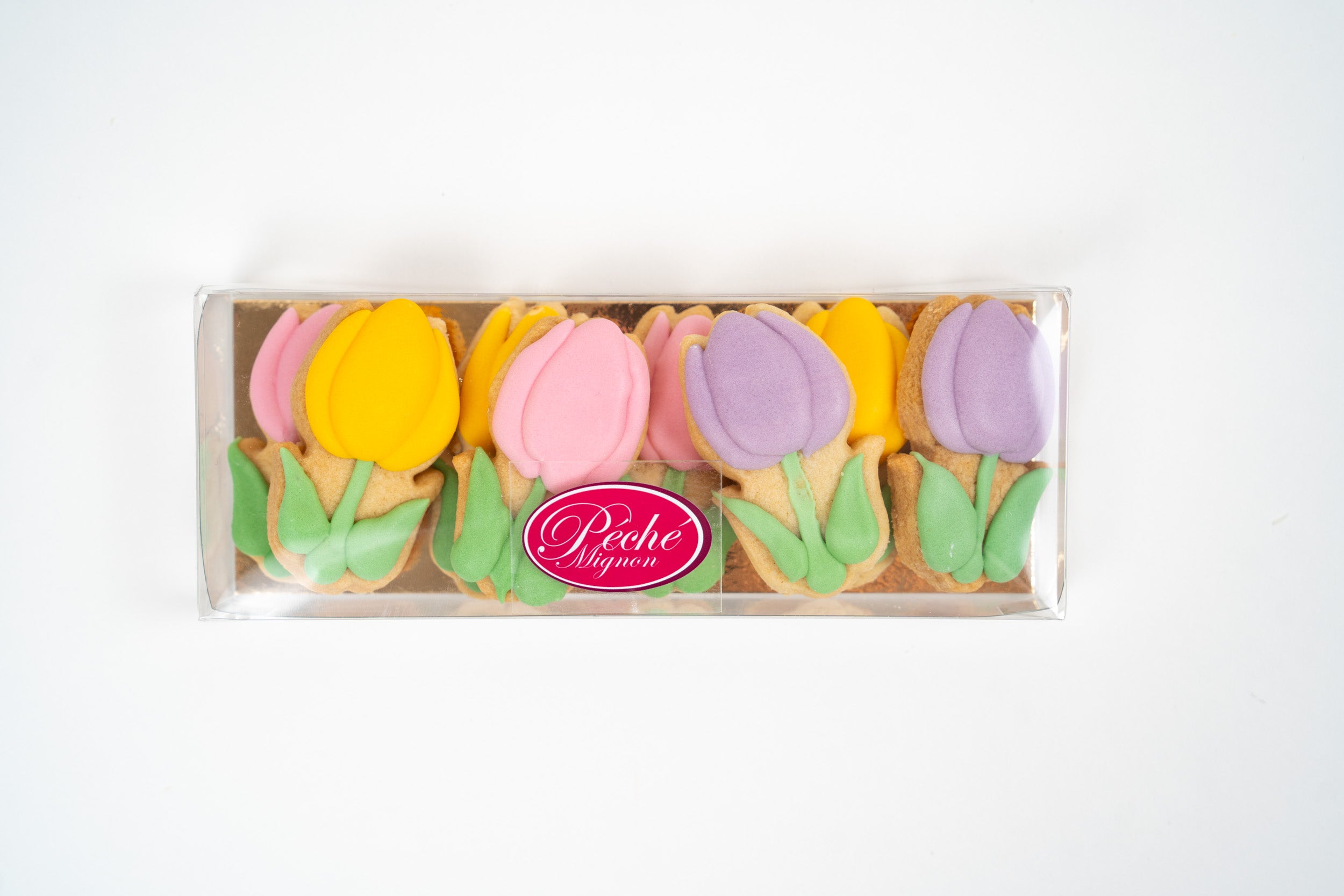 Assortiment de biscuits tulipes Péché Mignon, sablés décorés pour le printemps.