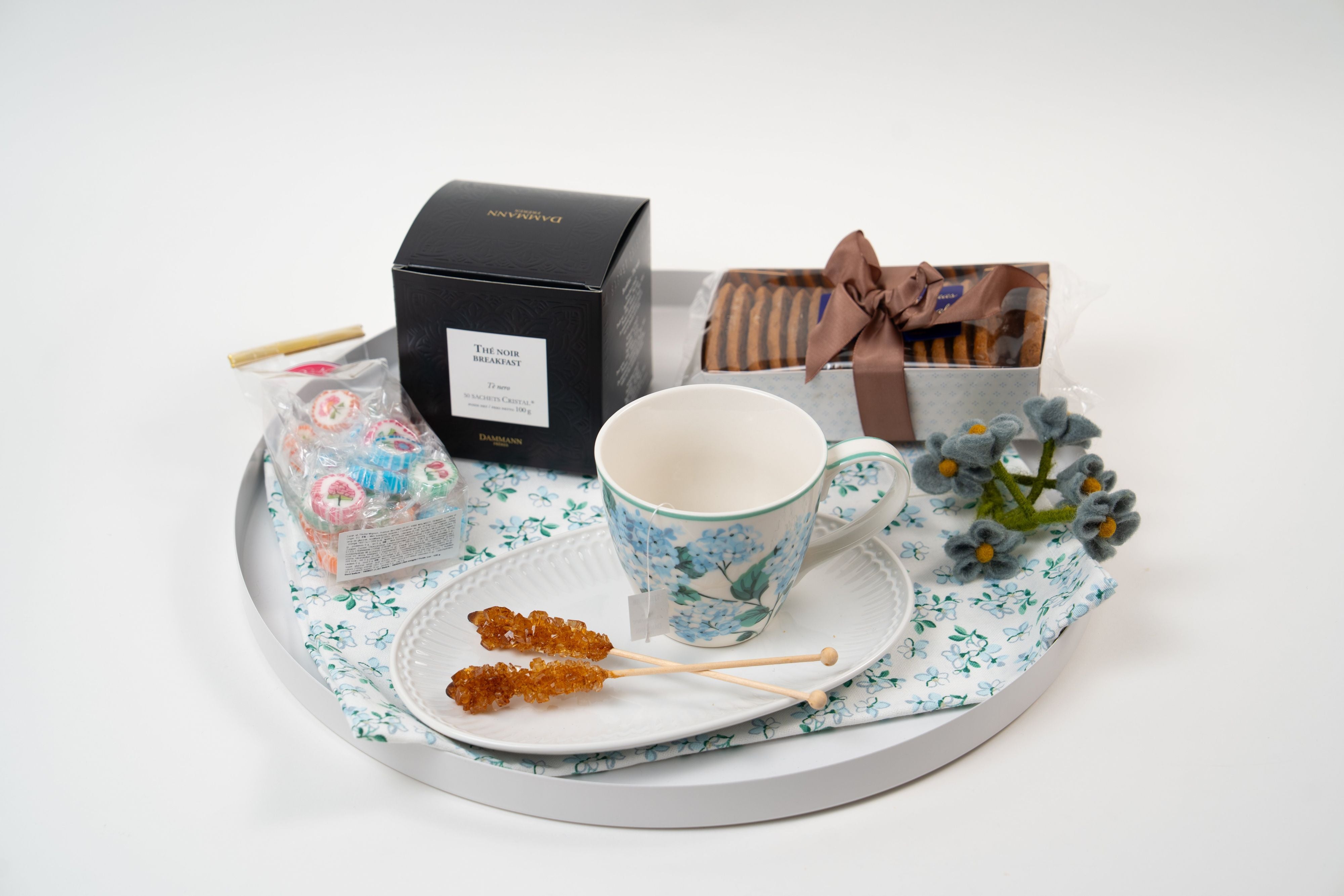 Close-up of artisan sweets and breakfast tea from Péché Mignon tea gift set