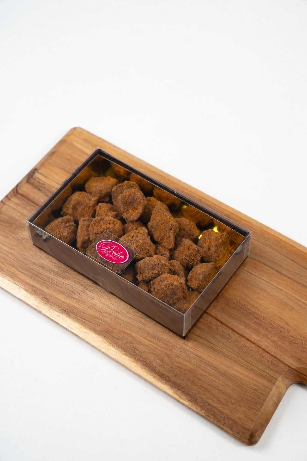 Coffret fermé Péché Mignon contenant 300 g de truffes au spéculoos.